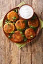 Aloo tikkiÃÂ is a popular Snack across India made using mashed potatoes close-up in a plate. Vertical top view